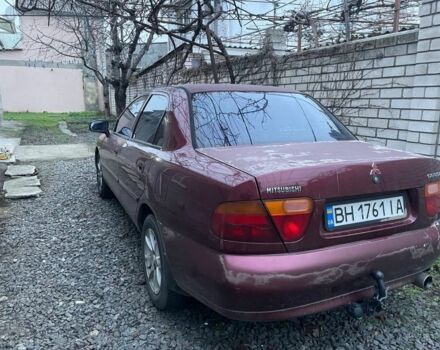 Красный Мицубиси Харизма, объемом двигателя 1.6 л и пробегом 306 тыс. км за 1500 $, фото 2 на Automoto.ua