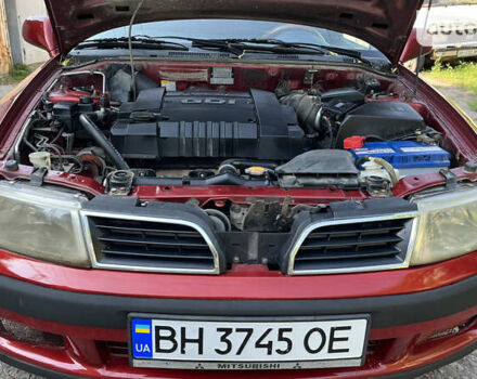 Червоний Міцубісі Харизма, об'ємом двигуна 1.83 л та пробігом 312 тис. км за 2950 $, фото 2 на Automoto.ua