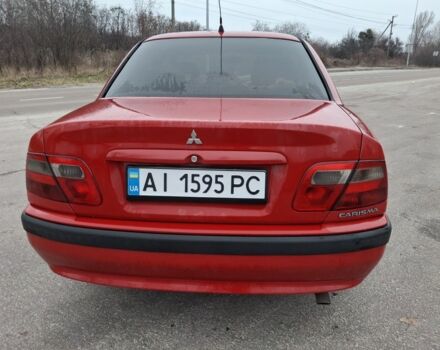 Красный Мицубиси Харизма, объемом двигателя 1.6 л и пробегом 310 тыс. км за 3199 $, фото 1 на Automoto.ua