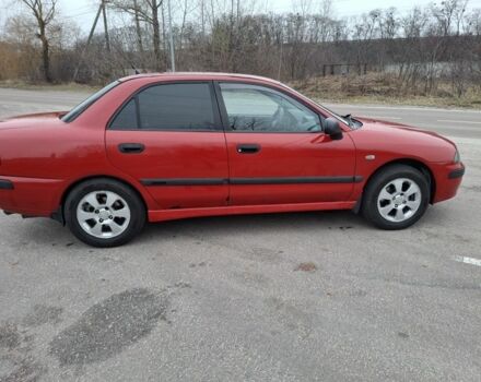 Красный Мицубиси Харизма, объемом двигателя 1.6 л и пробегом 310 тыс. км за 3199 $, фото 2 на Automoto.ua