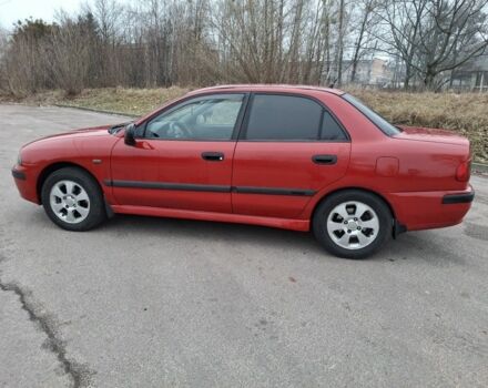 Красный Мицубиси Харизма, объемом двигателя 1.6 л и пробегом 310 тыс. км за 3199 $, фото 3 на Automoto.ua