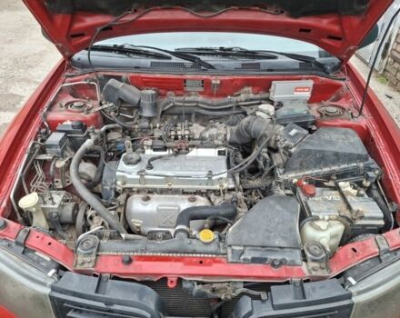 Красный Мицубиси Харизма, объемом двигателя 1.6 л и пробегом 310 тыс. км за 3199 $, фото 7 на Automoto.ua