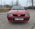 Красный Мицубиси Харизма, объемом двигателя 1.6 л и пробегом 310 тыс. км за 3199 $, фото 1 на Automoto.ua