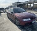 Красный Мицубиси Харизма, объемом двигателя 1.6 л и пробегом 340 тыс. км за 2400 $, фото 4 на Automoto.ua