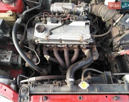 Красный Мицубиси Харизма, объемом двигателя 1.6 л и пробегом 270 тыс. км за 3000 $, фото 13 на Automoto.ua