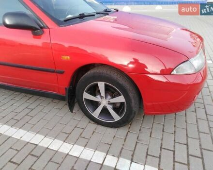 Красный Мицубиси Харизма, объемом двигателя 1.6 л и пробегом 270 тыс. км за 3000 $, фото 18 на Automoto.ua