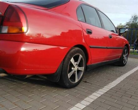 Красный Мицубиси Харизма, объемом двигателя 1.6 л и пробегом 270 тыс. км за 3000 $, фото 19 на Automoto.ua