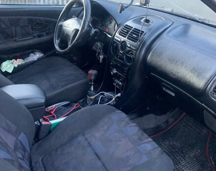 Красный Мицубиси Харизма, объемом двигателя 1.9 л и пробегом 350 тыс. км за 3000 $, фото 10 на Automoto.ua