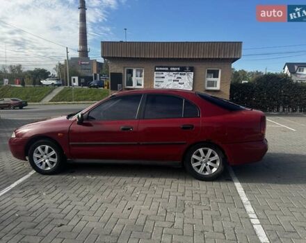 Красный Мицубиси Харизма, объемом двигателя 1.8 л и пробегом 350 тыс. км за 1900 $, фото 2 на Automoto.ua