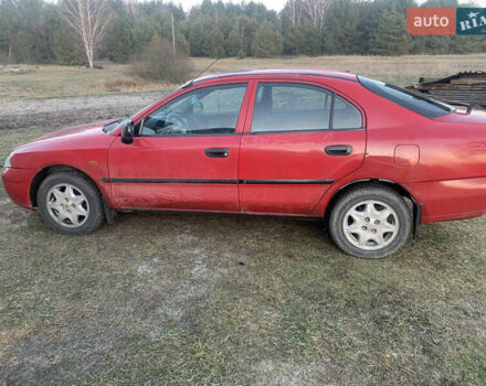 Красный Мицубиси Харизма, объемом двигателя 1.9 л и пробегом 350 тыс. км за 3000 $, фото 4 на Automoto.ua