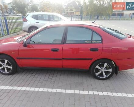 Красный Мицубиси Харизма, объемом двигателя 1.6 л и пробегом 270 тыс. км за 3000 $, фото 3 на Automoto.ua