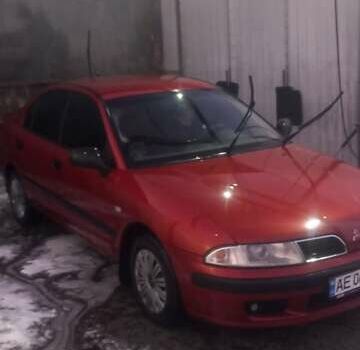 Красный Мицубиси Харизма, объемом двигателя 1.6 л и пробегом 450 тыс. км за 3000 $, фото 1 на Automoto.ua