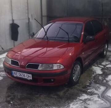 Красный Мицубиси Харизма, объемом двигателя 1.6 л и пробегом 450 тыс. км за 3000 $, фото 2 на Automoto.ua