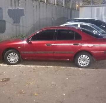 Красный Мицубиси Харизма, объемом двигателя 1.6 л и пробегом 450 тыс. км за 3000 $, фото 4 на Automoto.ua