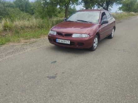 Міцубісі Харизма 1998 у Сторожинце на Automoto.ua Червоний Міцубісі Харизма, об'ємом двигуна 1.6 л та пробігом 233 тис. км за 2500 $, фото 1 на Automoto.ua