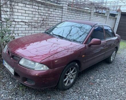 Красный Мицубиси Харизма, объемом двигателя 1.6 л и пробегом 306 тыс. км за 1500 $, фото 1 на Automoto.ua