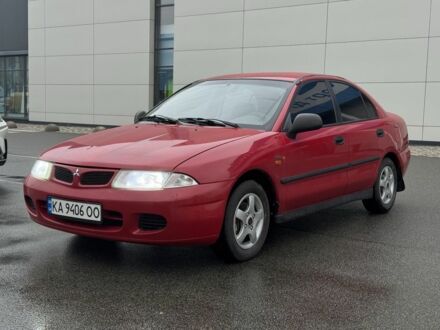 Красный Мицубиси Харизма, объемом двигателя 1.8 л и пробегом 140 тыс. км за 3400 $, фото 1 на Automoto.ua