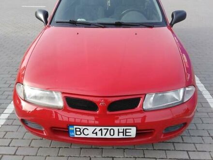 Красный Мицубиси Харизма, объемом двигателя 1.6 л и пробегом 270 тыс. км за 3000 $, фото 1 на Automoto.ua