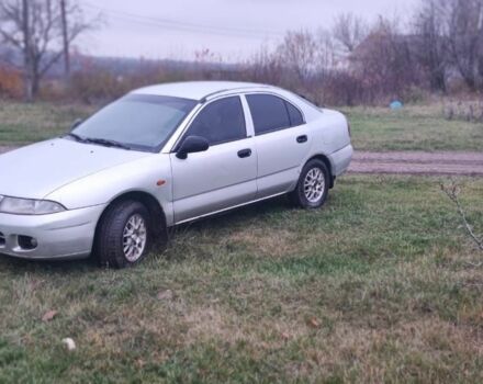 Серый Мицубиси Харизма, объемом двигателя 1.6 л и пробегом 1 тыс. км за 1400 $, фото 1 на Automoto.ua