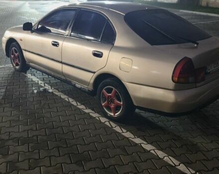 Серый Мицубиси Харизма, объемом двигателя 1.8 л и пробегом 350 тыс. км за 1500 $, фото 3 на Automoto.ua