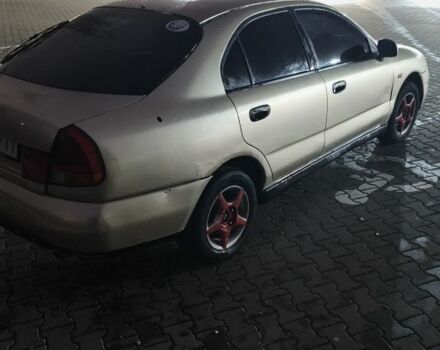 Серый Мицубиси Харизма, объемом двигателя 1.8 л и пробегом 350 тыс. км за 1500 $, фото 4 на Automoto.ua