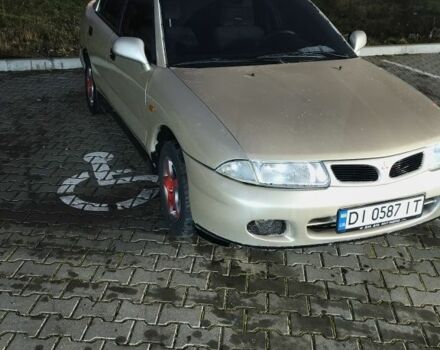 Серый Мицубиси Харизма, объемом двигателя 1.8 л и пробегом 350 тыс. км за 1500 $, фото 1 на Automoto.ua