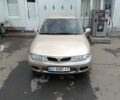 Серый Мицубиси Харизма, объемом двигателя 1.8 л и пробегом 350 тыс. км за 2000 $, фото 1 на Automoto.ua