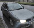 Сірий Міцубісі Харизма, об'ємом двигуна 1.8 л та пробігом 379 тис. км за 1307 $, фото 1 на Automoto.ua