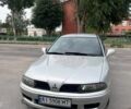 Серый Мицубиси Харизма, объемом двигателя 1.8 л и пробегом 1 тыс. км за 2890 $, фото 1 на Automoto.ua