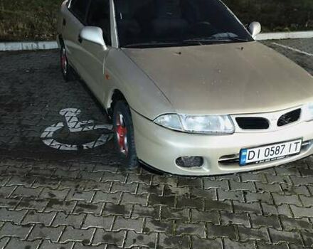 Серый Мицубиси Харизма, объемом двигателя 1.83 л и пробегом 350 тыс. км за 1500 $, фото 1 на Automoto.ua