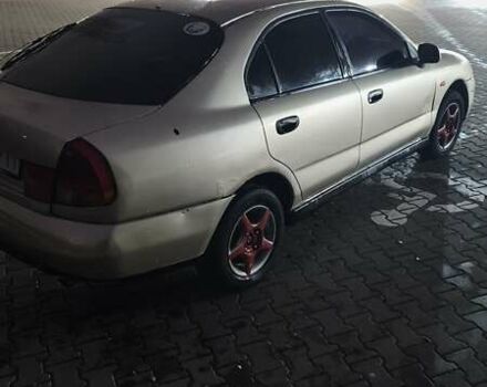 Серый Мицубиси Харизма, объемом двигателя 1.83 л и пробегом 350 тыс. км за 1500 $, фото 5 на Automoto.ua