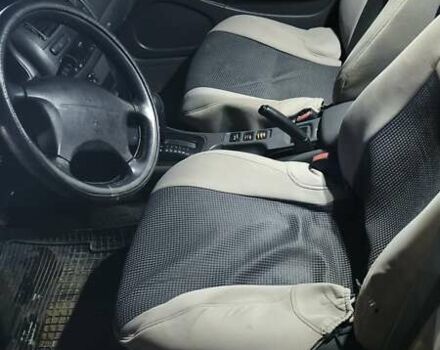 Серый Мицубиси Харизма, объемом двигателя 1.83 л и пробегом 350 тыс. км за 1500 $, фото 8 на Automoto.ua