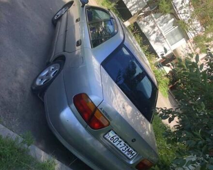 Серый Мицубиси Харизма, объемом двигателя 1.6 л и пробегом 260 тыс. км за 2000 $, фото 3 на Automoto.ua