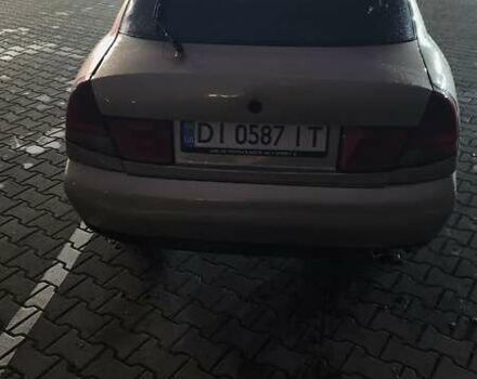 Серый Мицубиси Харизма, объемом двигателя 1.83 л и пробегом 350 тыс. км за 1500 $, фото 4 на Automoto.ua