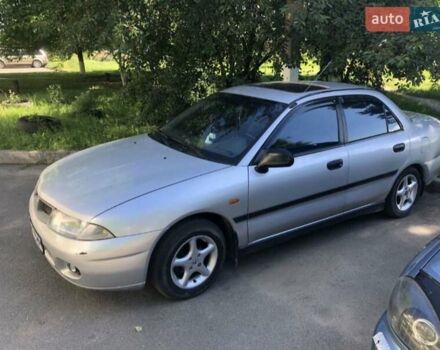 Серый Мицубиси Харизма, объемом двигателя 1.6 л и пробегом 260 тыс. км за 2000 $, фото 4 на Automoto.ua