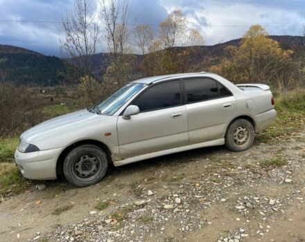 Серый Мицубиси Харизма, объемом двигателя 1.6 л и пробегом 270 тыс. км за 750 $, фото 1 на Automoto.ua