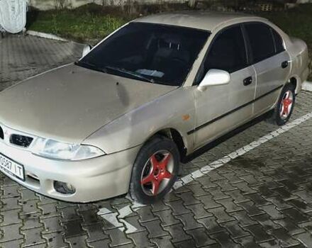 Серый Мицубиси Харизма, объемом двигателя 1.83 л и пробегом 350 тыс. км за 1500 $, фото 2 на Automoto.ua