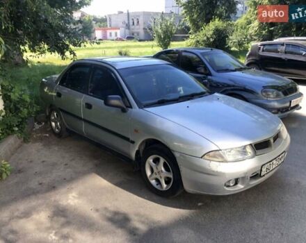 Серый Мицубиси Харизма, объемом двигателя 1.6 л и пробегом 260 тыс. км за 2000 $, фото 2 на Automoto.ua