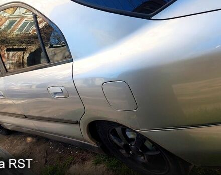 Серый Мицубиси Харизма, объемом двигателя 1.8 л и пробегом 320 тыс. км за 1600 $, фото 4 на Automoto.ua