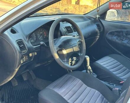 Сірий Міцубісі Харизма, об'ємом двигуна 1.83 л та пробігом 350 тис. км за 1499 $, фото 20 на Automoto.ua
