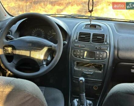 Сірий Міцубісі Харизма, об'ємом двигуна 1.83 л та пробігом 350 тис. км за 1499 $, фото 14 на Automoto.ua