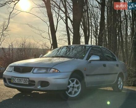 Сірий Міцубісі Харизма, об'ємом двигуна 1.83 л та пробігом 350 тис. км за 1499 $, фото 1 на Automoto.ua