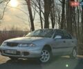 Сірий Міцубісі Харизма, об'ємом двигуна 1.83 л та пробігом 350 тис. км за 1499 $, фото 1 на Automoto.ua
