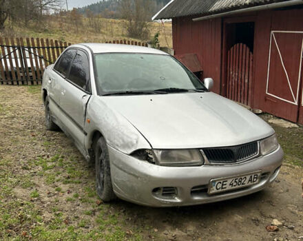 Сірий Міцубісі Харизма, об'ємом двигуна 1.9 л та пробігом 368 тис. км за 1000 $, фото 1 на Automoto.ua
