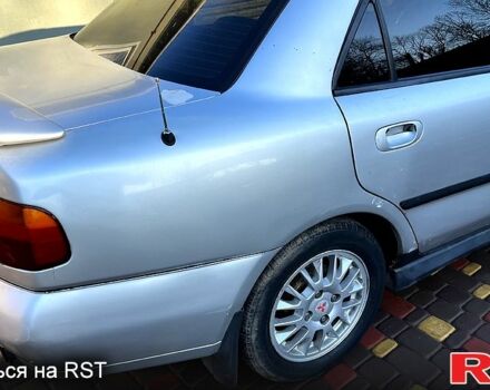 Сірий Міцубісі Харизма, об'ємом двигуна 1.8 л та пробігом 296 тис. км за 1600 $, фото 6 на Automoto.ua