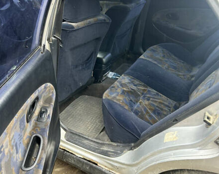 Сірий Міцубісі Харизма, об'ємом двигуна 1.9 л та пробігом 368 тис. км за 1000 $, фото 6 на Automoto.ua