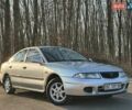 Сірий Міцубісі Харизма, об'ємом двигуна 1.83 л та пробігом 350 тис. км за 1499 $, фото 1 на Automoto.ua