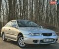 Серый Мицубиси Харизма, объемом двигателя 1.83 л и пробегом 350 тыс. км за 1500 $, фото 1 на Automoto.ua