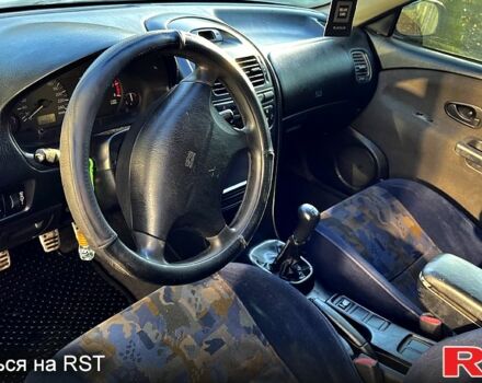 Сірий Міцубісі Харизма, об'ємом двигуна 1.8 л та пробігом 296 тис. км за 1600 $, фото 10 на Automoto.ua