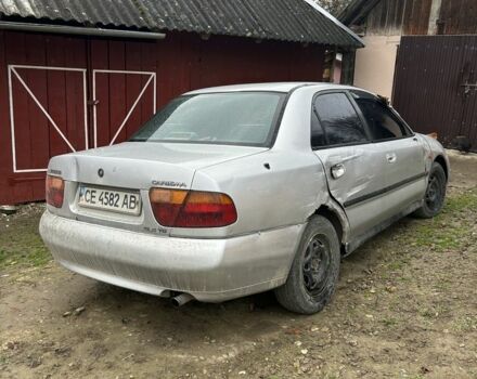 Сірий Міцубісі Харизма, об'ємом двигуна 1.9 л та пробігом 350 тис. км за 1000 $, фото 4 на Automoto.ua